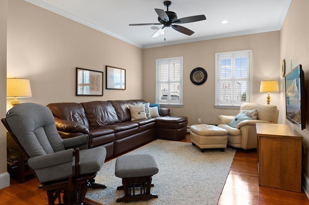 8 Sheafe Street, Unit 1 Boston, MA 02129 - Photo 6 of 19 a living room with furniture ceiling fan and a window