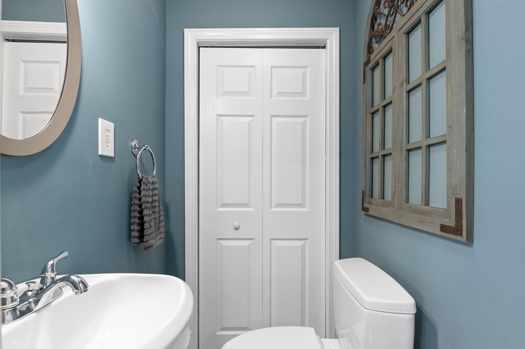 8 Sheafe Street, Unit 1 Boston, MA 02129 - Photo 7 of 19 a bathroom with a toilet a sink and mirror