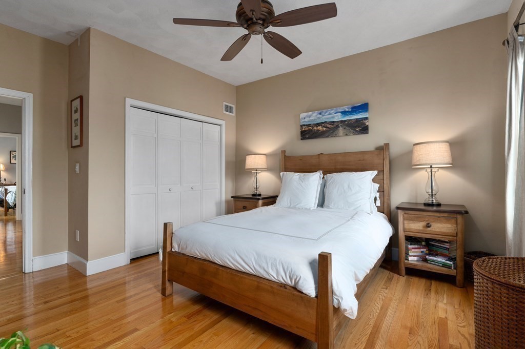 8 Sheafe Street, Unit 1 Boston, MA 02129 - Photo 9 of 19 a bedroom with a bed and wooden floor