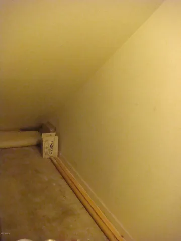 a street sign that is on a wooden wall