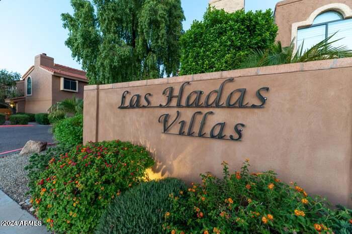 5640 East Bell Road, Unit 1022 Scottsdale, AZ 85254 - Photo 18 of 27 a street sign that is on a wooden wall