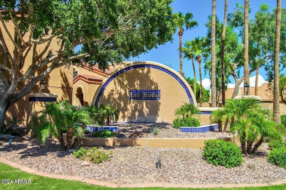 5640 East Bell Road, Unit 1022 Scottsdale, AZ 85254 - Photo 20 of 27 a front view of a house with garden