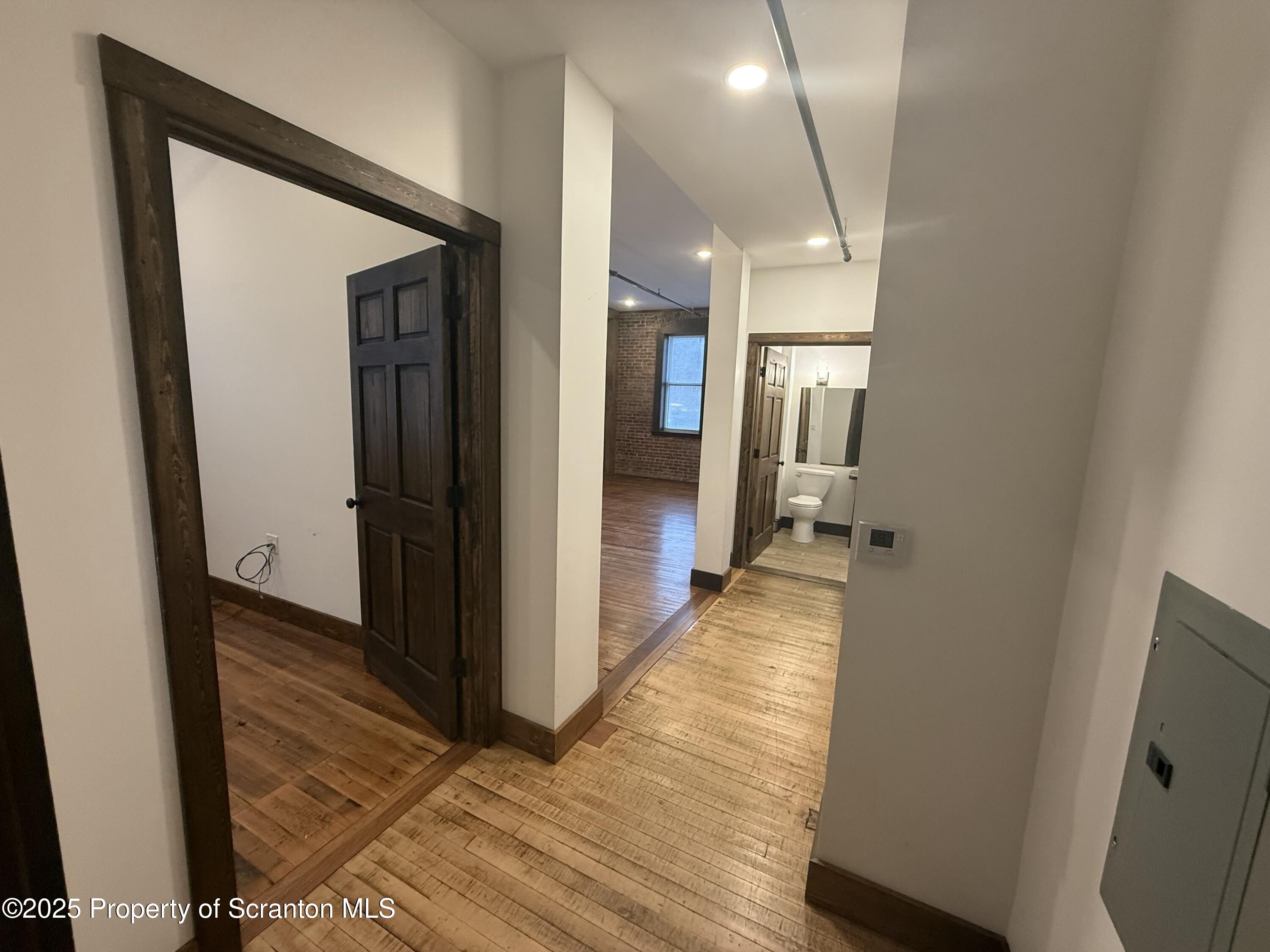 103 Park Street, Unit 1A Honesdale, PA 18431 - Photo 11 of 15 a view of hallway with wooden floor