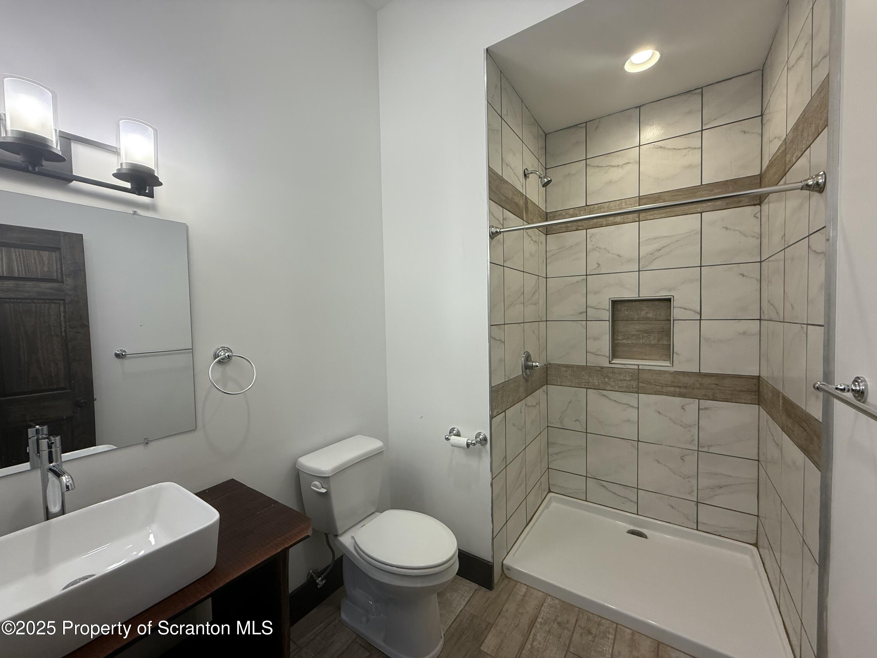 103 Park Street, Unit 1A Honesdale, PA 18431 - Photo 10 of 15 a bathroom with a sink toilet and shower