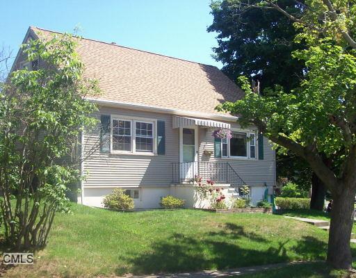 1031 Huntington Road Stratford, CT 06614 - Photo 1 of 1 a front view of a house with a garden
