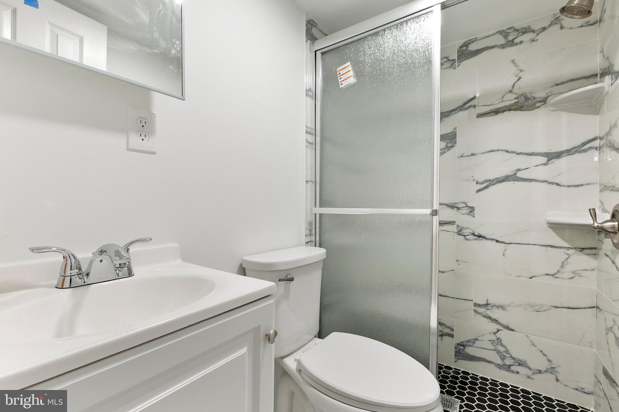 12829 Baker Drive Silver Spring, MD 20904 - Photo 34 of 59 a bathroom with a sink toilet and shower