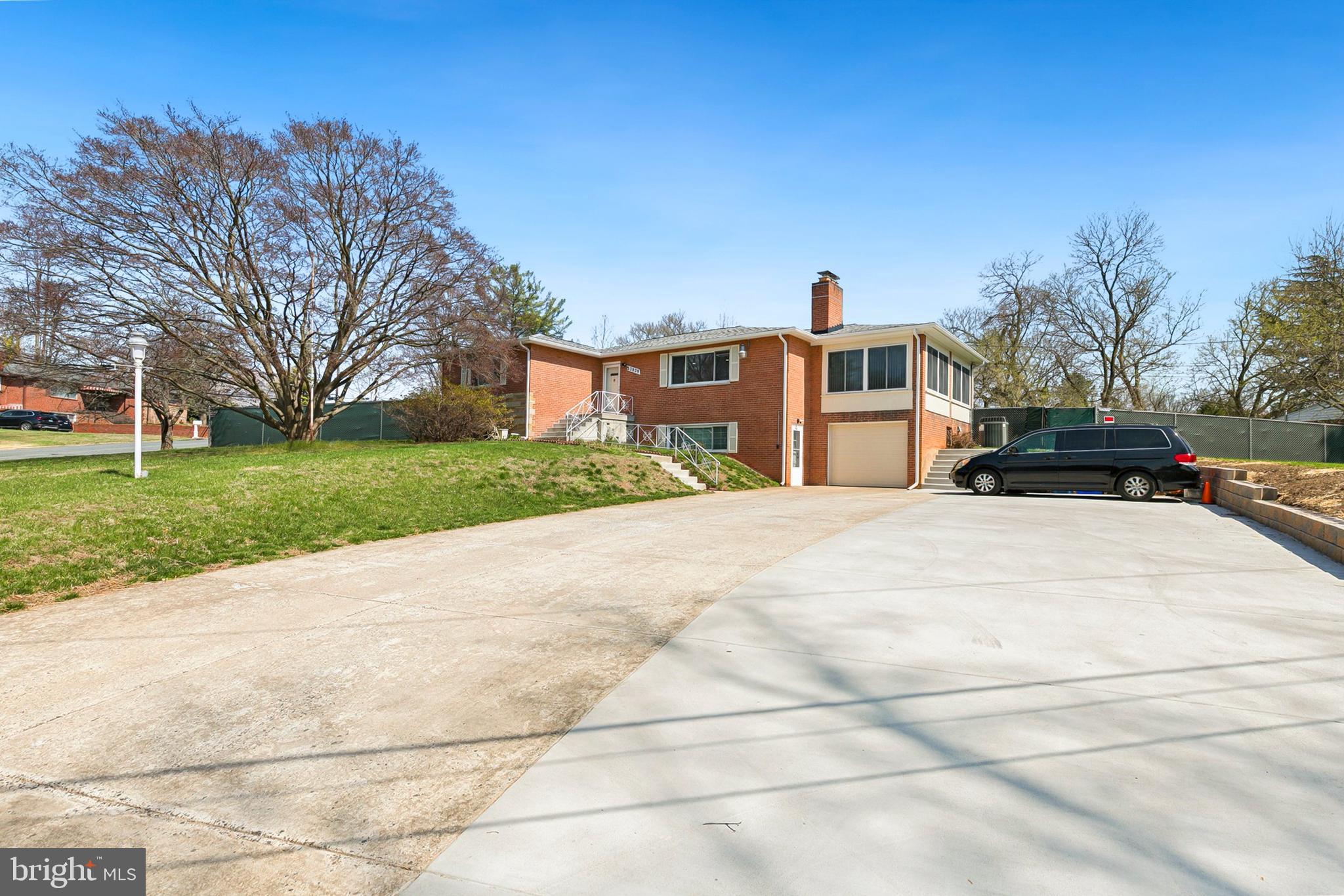 12829 Baker Drive Silver Spring, MD 20904 - Photo 57 of 59 a view of a white house with a outdoor space