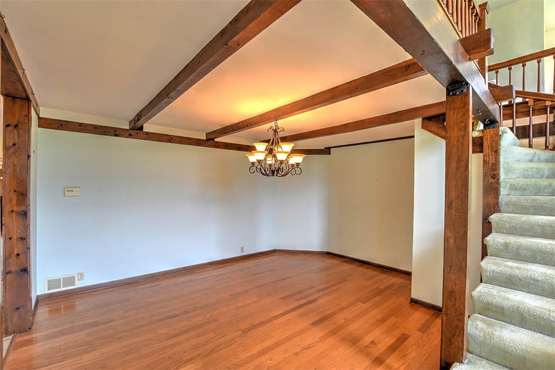 877 East 1800 North Road Assumption, IL 62510 - Photo 28 of 46 a view of a room with wooden floor and a ceiling fan