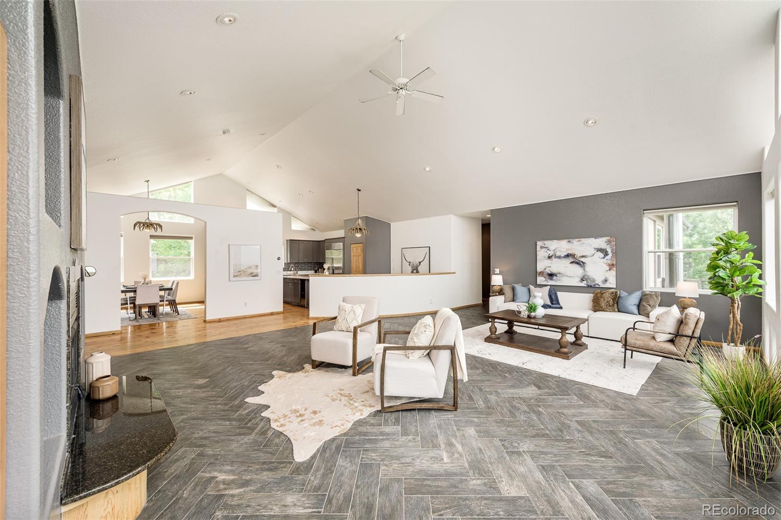 1453 Santa Fe Mountain Road Evergreen, CO 80439 - Photo 13 of 50 a living room with furniture and a large window