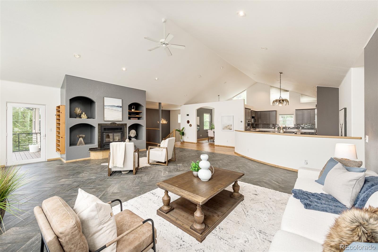 1453 Santa Fe Mountain Road Evergreen, CO 80439 - Photo 15 of 50 a living room with furniture and a kitchen view