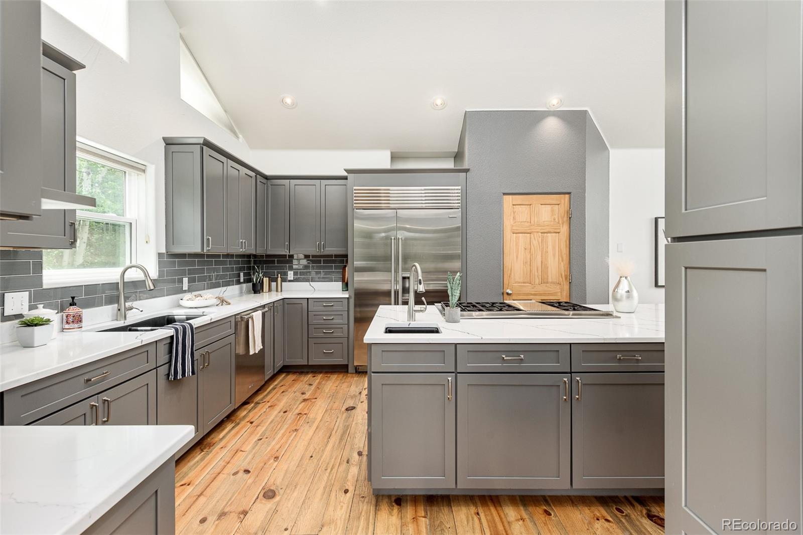 1453 Santa Fe Mountain Road Evergreen, CO 80439 - Photo 18 of 50 a kitchen with sink cabinets and window