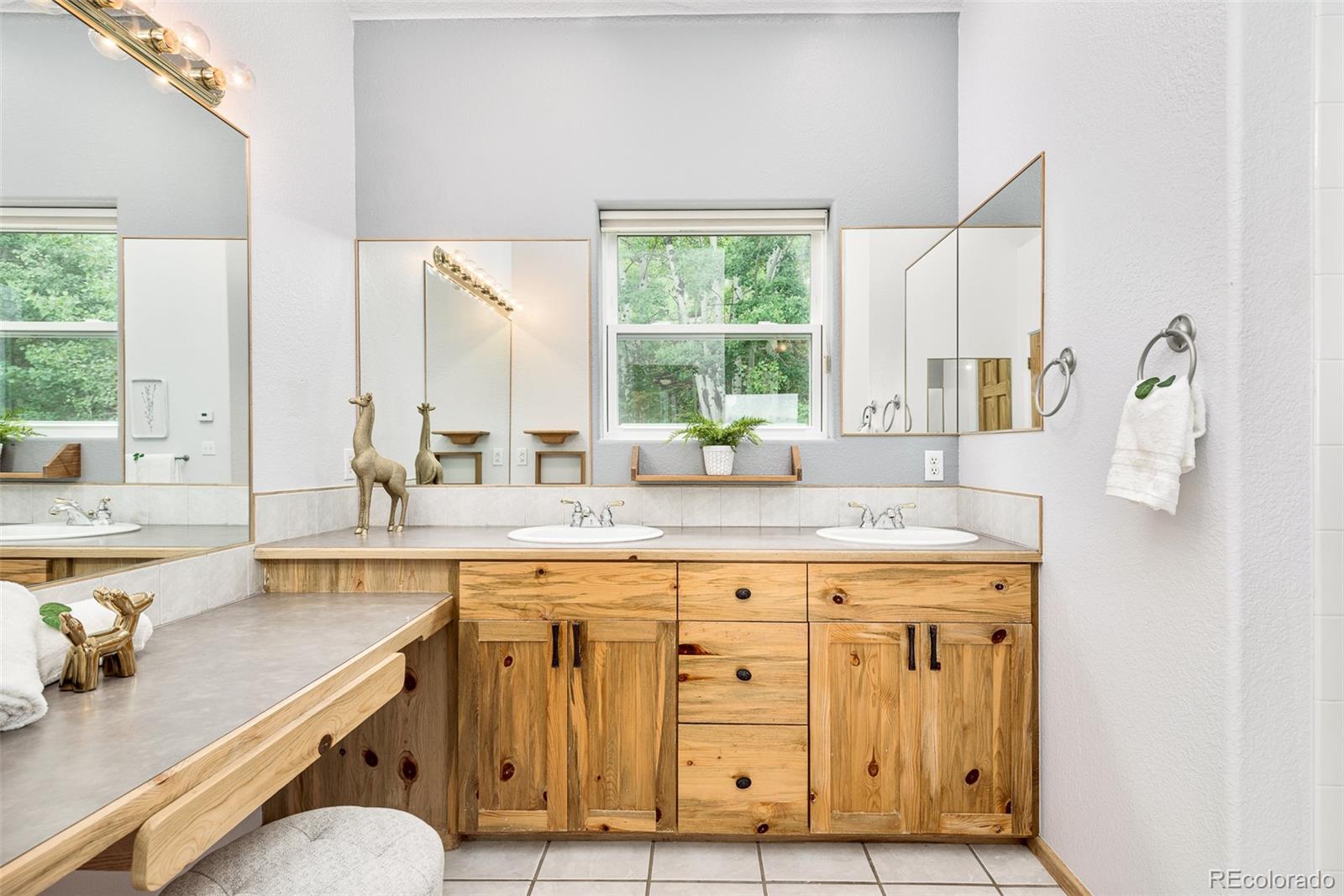1453 Santa Fe Mountain Road Evergreen, CO 80439 - Photo 28 of 50 a kitchen with a sink cabinets and window