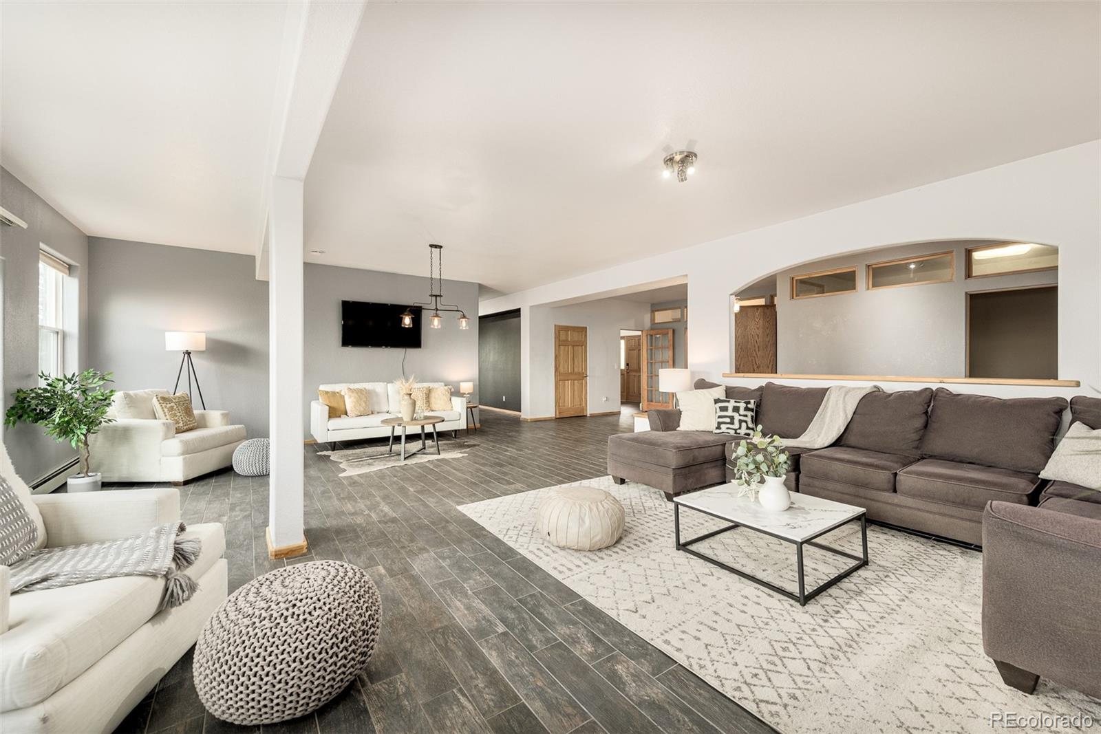 1453 Santa Fe Mountain Road Evergreen, CO 80439 - Photo 38 of 50 a living room with furniture and a couch