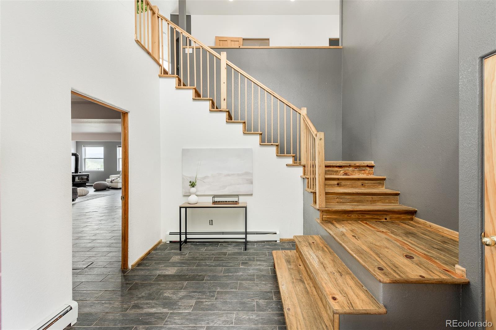 1453 Santa Fe Mountain Road Evergreen, CO 80439 - Photo 6 of 50 a view of entryway and hall with wooden floor
