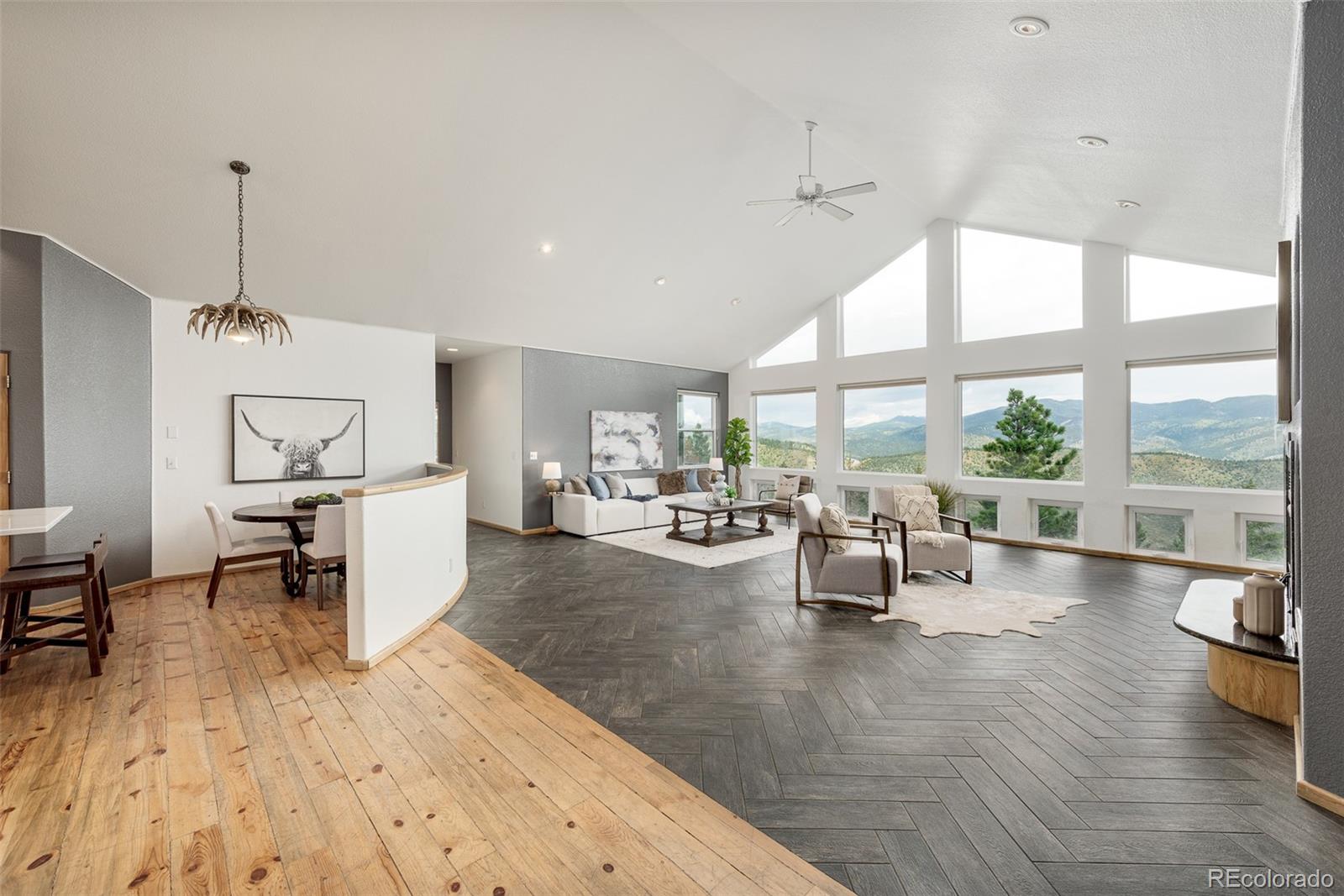 1453 Santa Fe Mountain Road Evergreen, CO 80439 - Photo 9 of 50 a living room with furniture and a large window