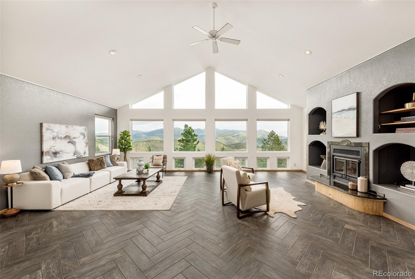 1453 Santa Fe Mountain Road Evergreen, CO 80439 - Photo 10 of 50 a living room with fireplace furniture and a large window