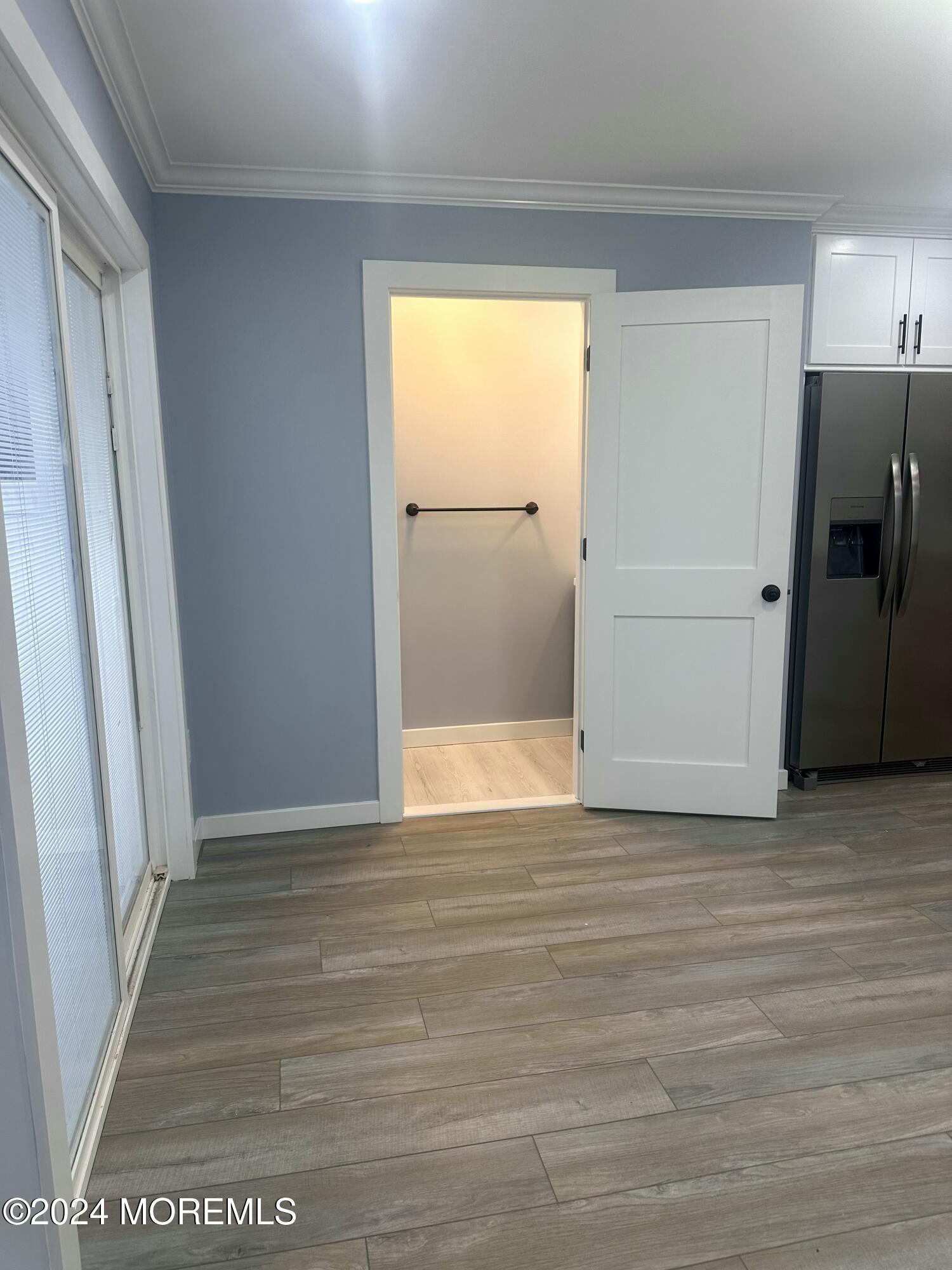 73 Church Street Manasquan, NJ 08736 - Photo 16 of 27 a view of an empty room with wooden floor and a window