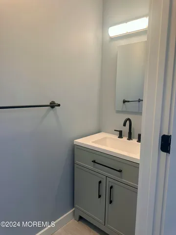 a bathroom with a sink a toilet and a bathtub