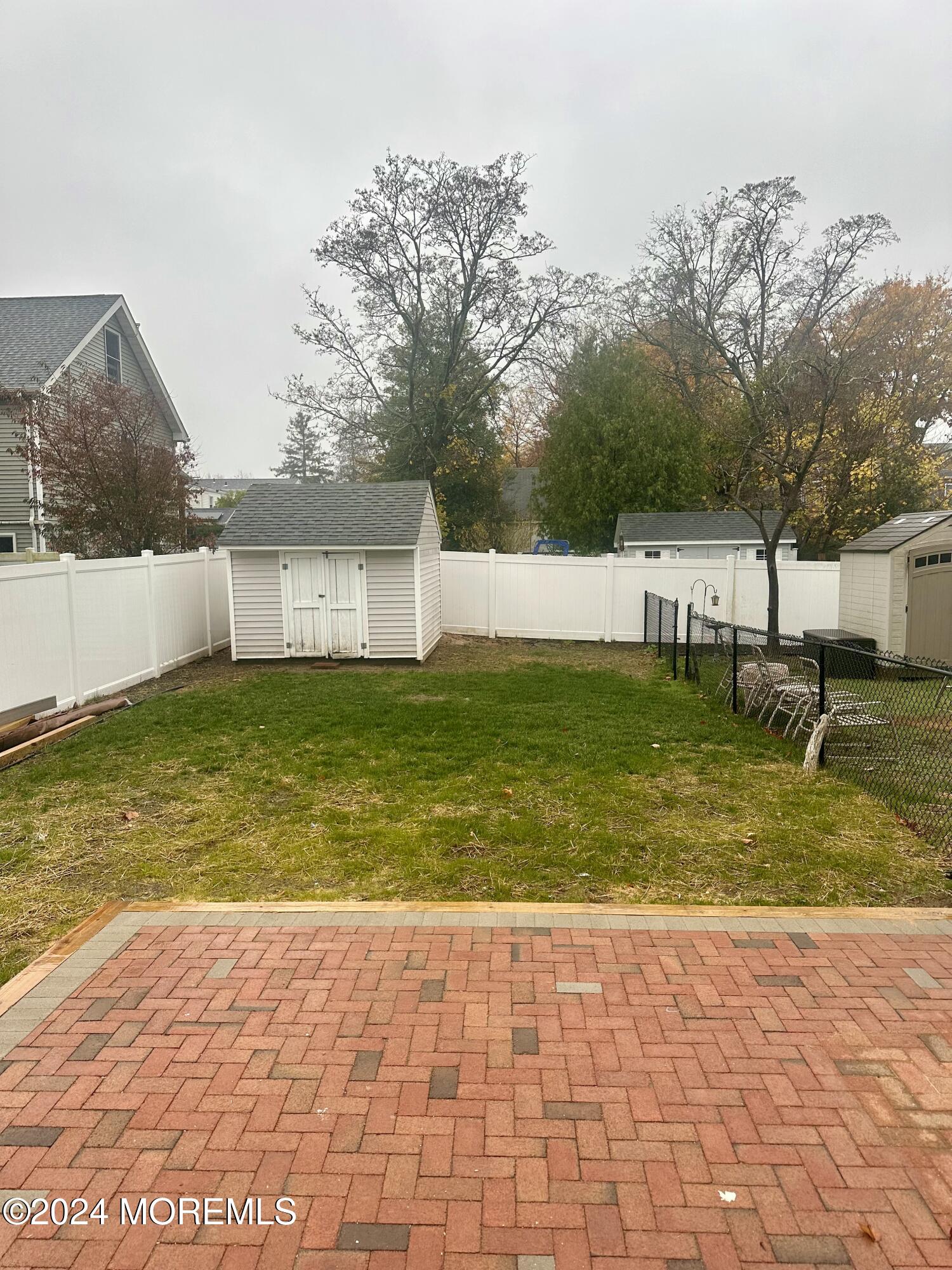 73 Church Street Manasquan, NJ 08736 - Photo 25 of 27 a view of a swimming pool with an outdoor space