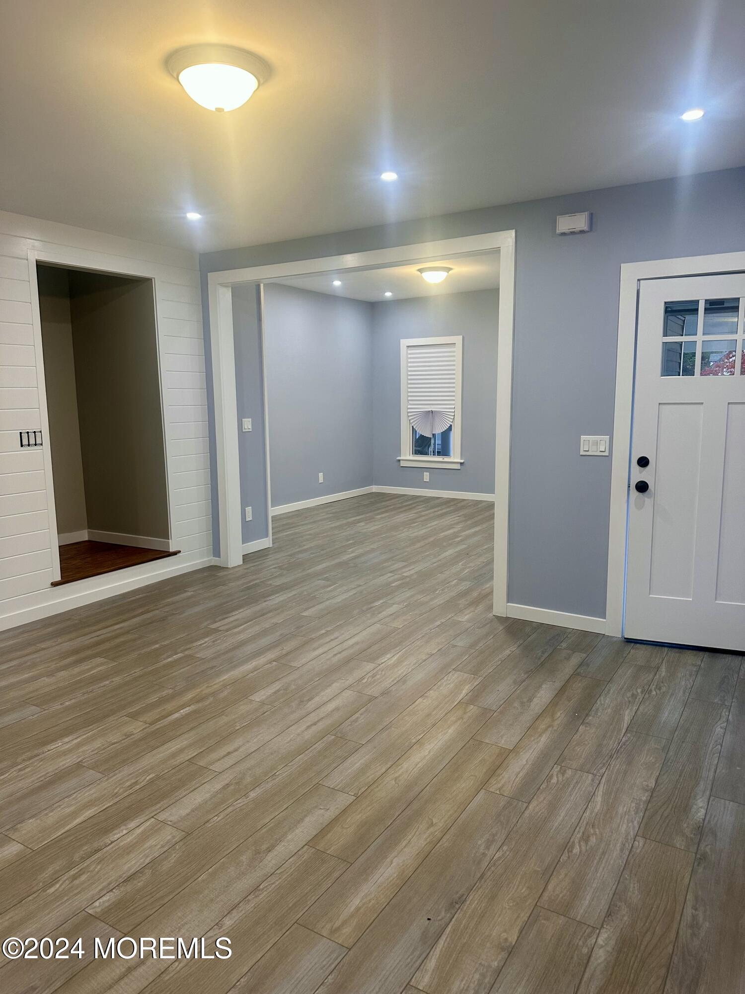73 Church Street Manasquan, NJ 08736 - Photo 5 of 27 a view of an empty room with wooden floor and closet