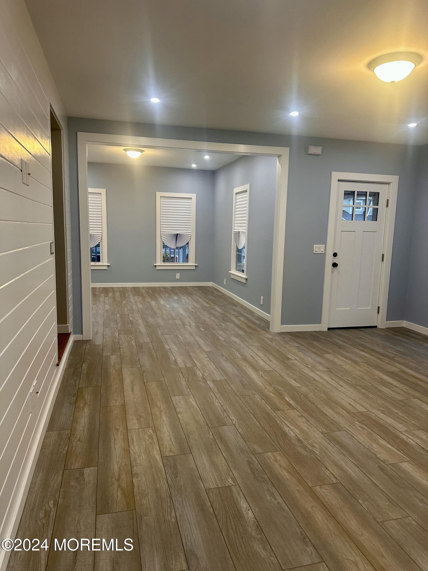 73 Church Street Manasquan, NJ 08736 - Photo 6 of 27 wooden floor in an empty room with a window