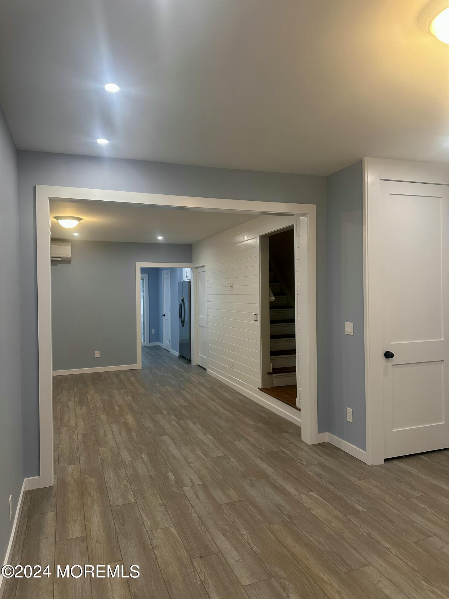 73 Church Street Manasquan, NJ 08736 - Photo 9 of 27 a view of an empty room with wooden floor and closet