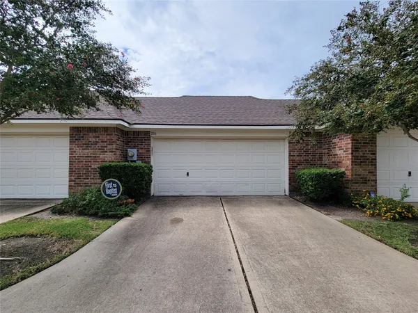 a front view of a house with garage