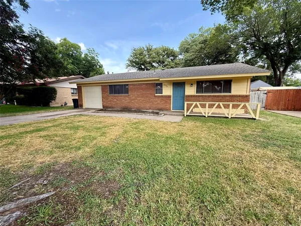 a house that has a big yard in front of it