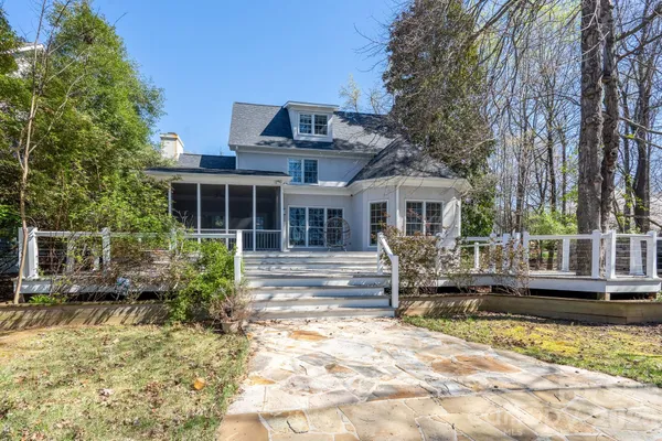 a front view of house with yard outdoor seating and barbeque oven