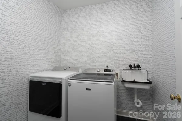 a utility room with dryer and washer