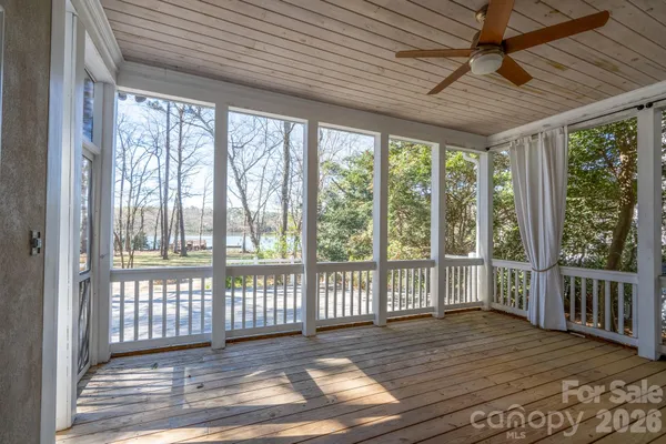 a view of a porch with wooden floor