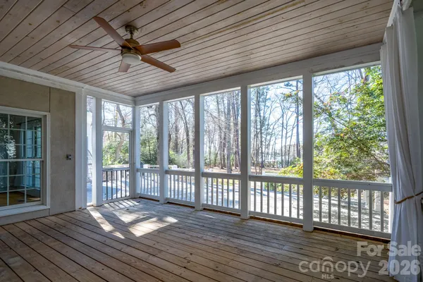 a view of a porch with wooden floor