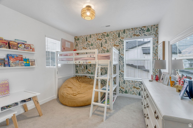 3452 Mapleton Hts Drive Mapleton, UT 84664 - Photo 22 of 40 Plush carpet flooring, a decorative accent wall, and a woven pendant light fixture