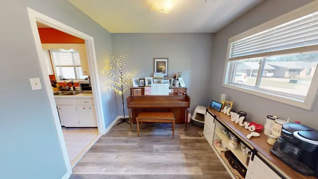 a bedroom with furniture and a window