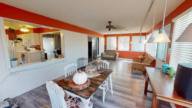 a view of a dining room with furniture window and wooden floor