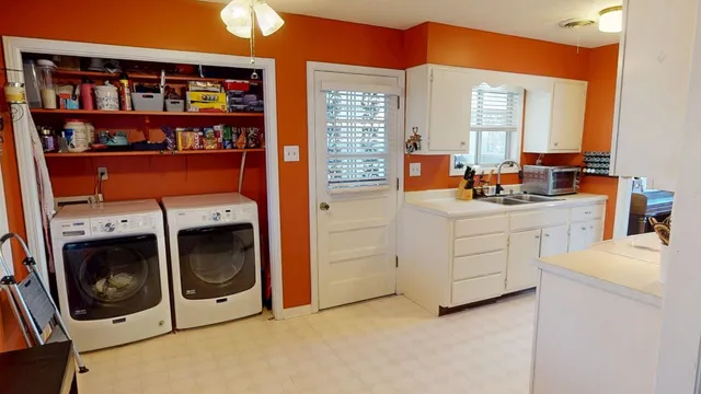 a utility room with washer and dryer