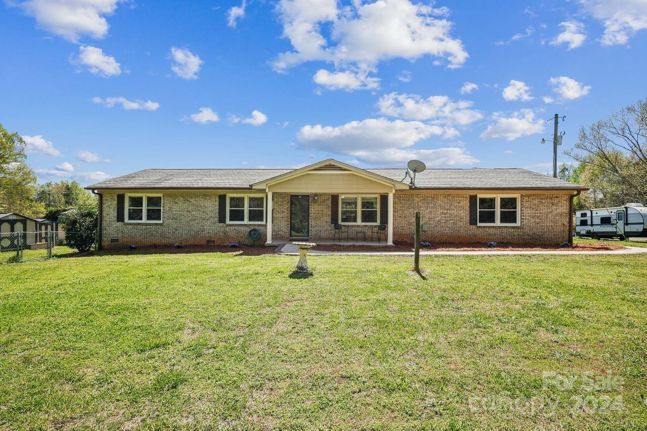 2362 Agony Acres Road Clover, SC 29710 - Photo 2 of 36 a house with swimming pool in front of it