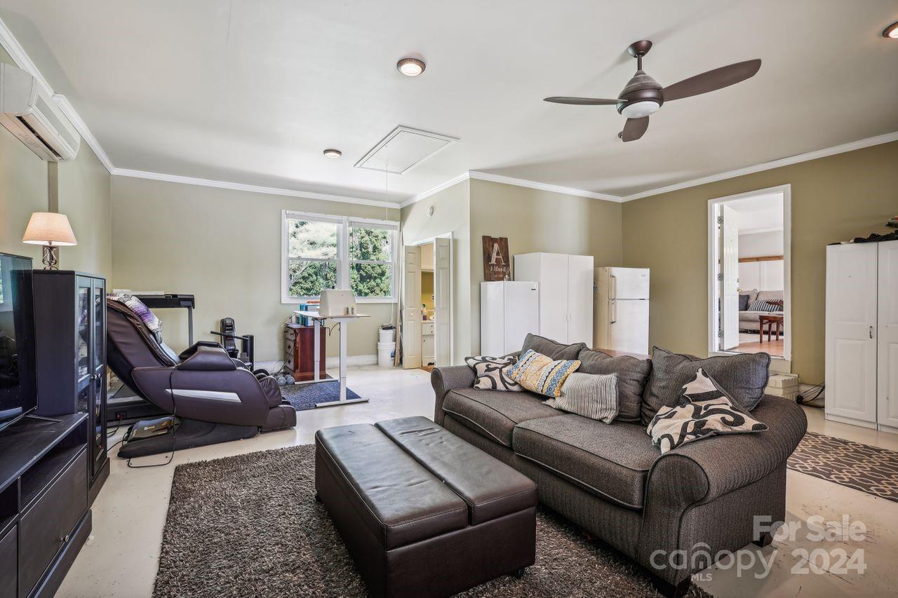 2362 Agony Acres Road Clover, SC 29710 - Photo 23 of 36 a living room with furniture ceiling fan and a window
