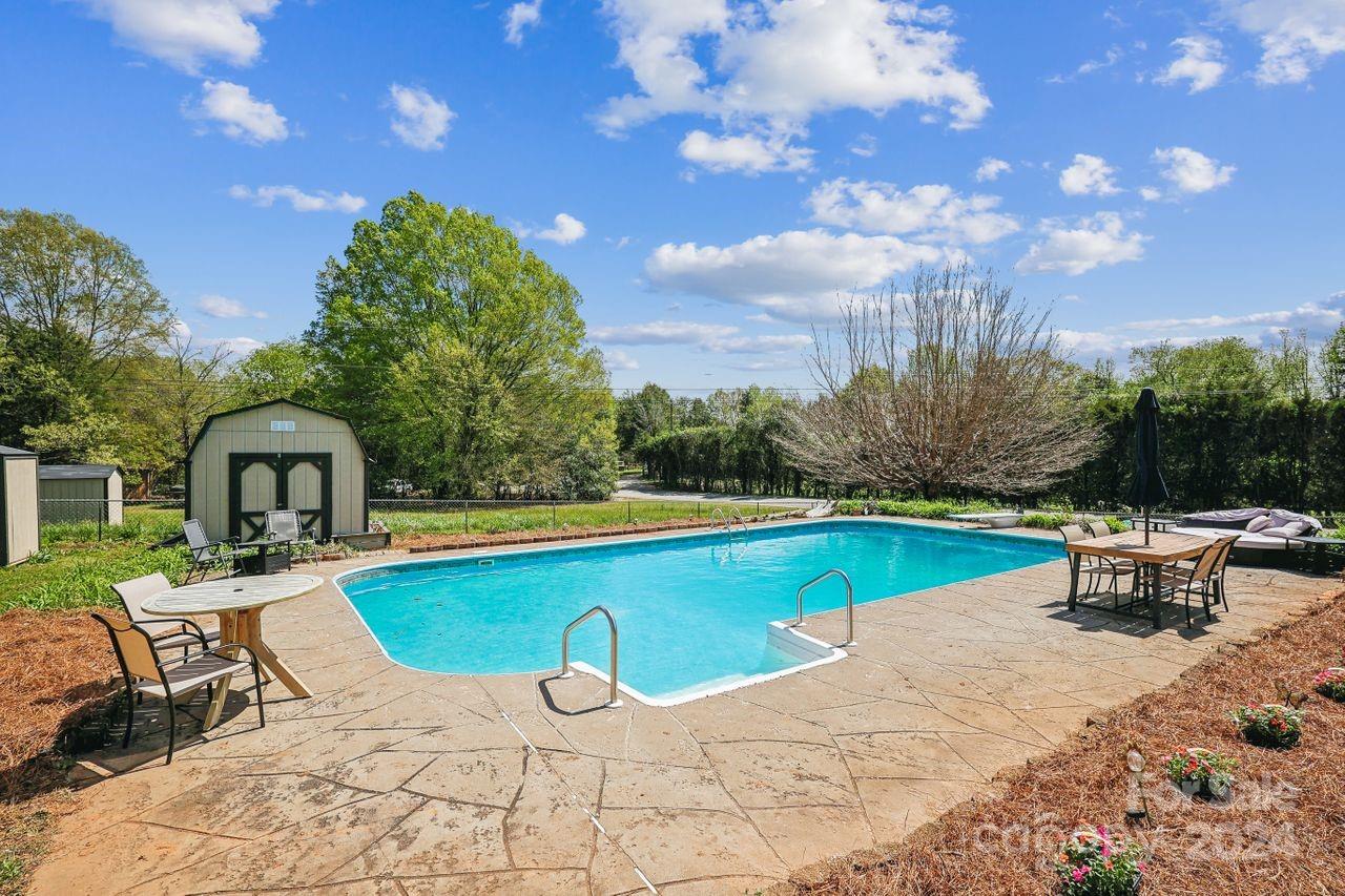 2362 Agony Acres Road Clover, SC 29710 - Photo 26 of 36 a view of a swimming pool with lounge chairs