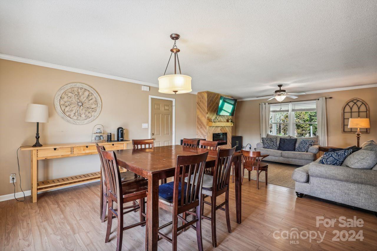 2362 Agony Acres Road Clover, SC 29710 - Photo 9 of 36 a view of a dining room with furniture window and wooden floor