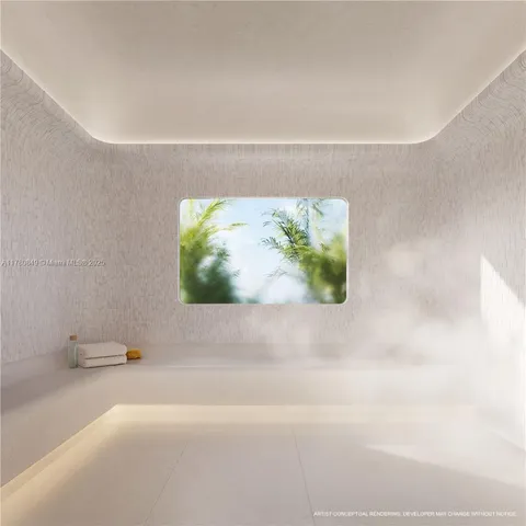 a view of a room with gym equipment and floor to ceiling window