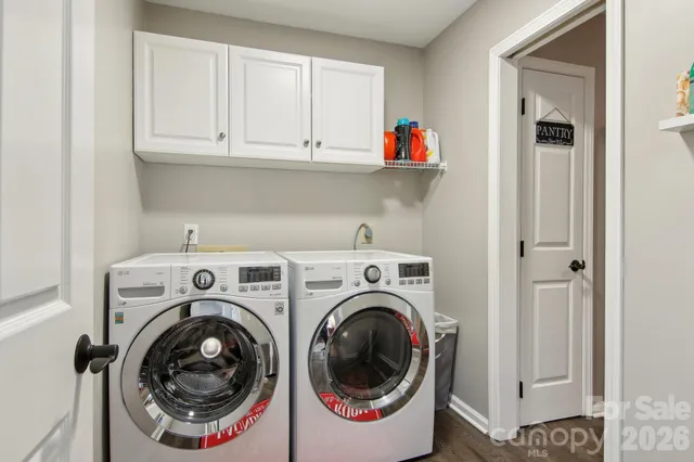 a utility room with dryer and washer