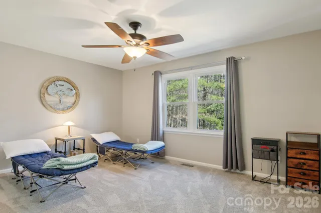 a living room with furniture a window and a large window
