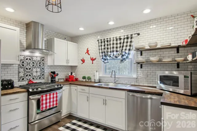 a kitchen with sink cabinets and window