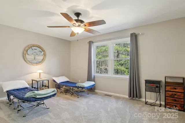 a living room with furniture a window and a large window