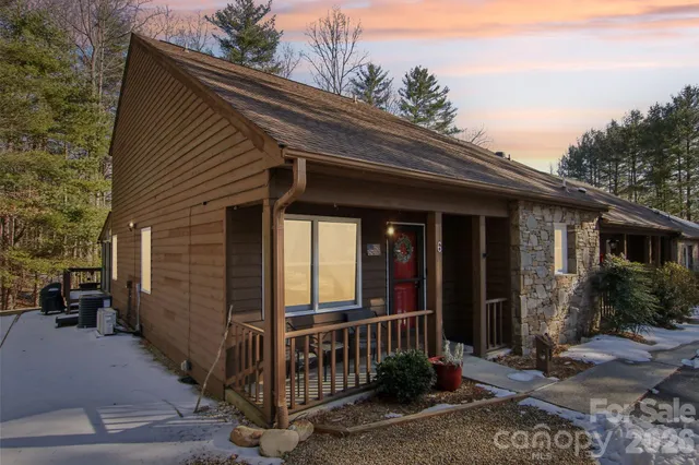 a view of house with yard and green space