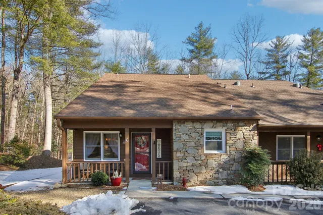 a view of a porch with furniture and garden