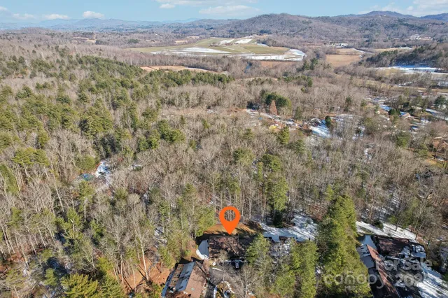 a aerial view of a house with a yard