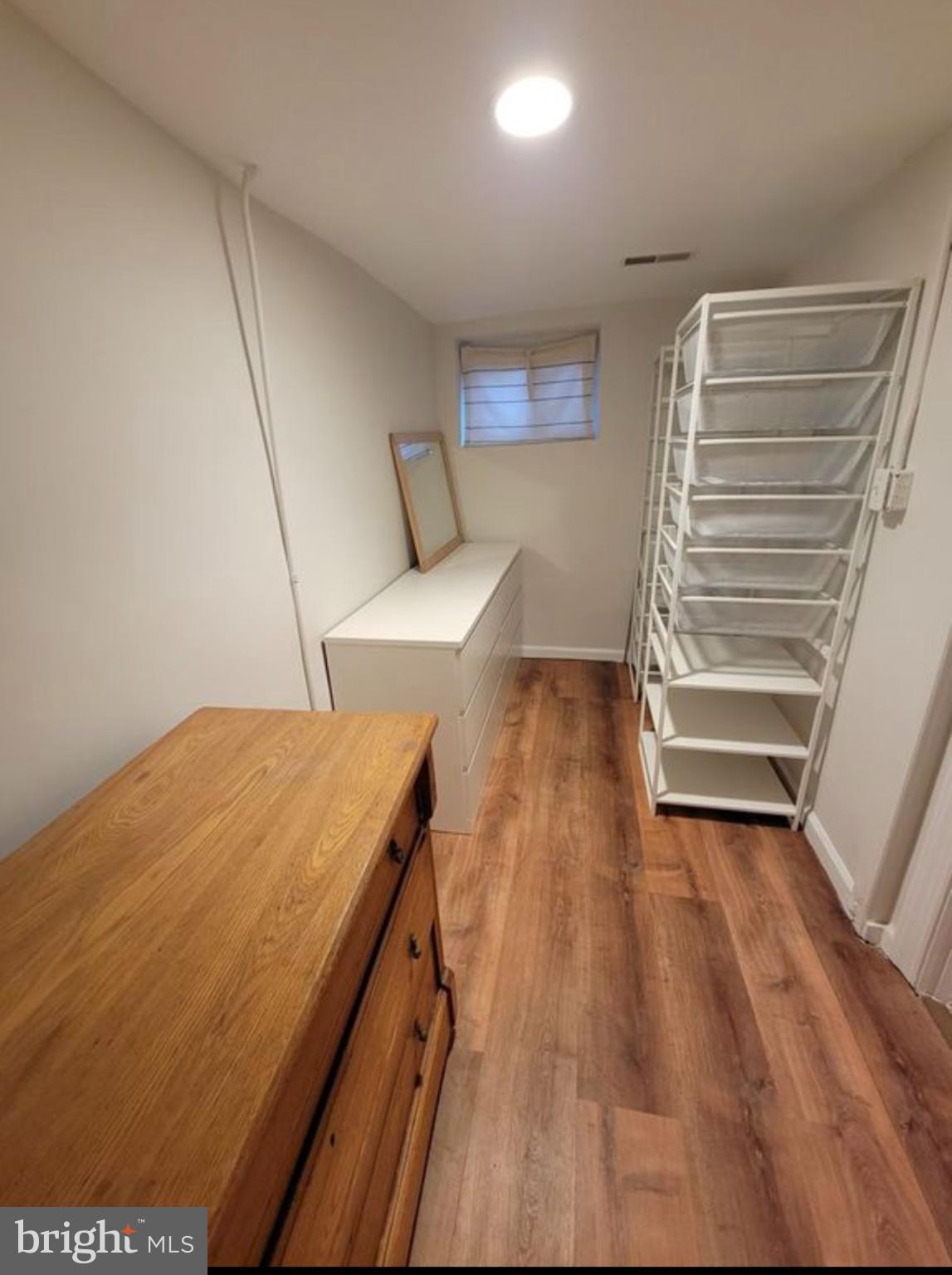 1418 44th Street Northwest, Unit B Washington, DC 20007 - Photo 11 of 20 a view of a room with wooden floor and staircase