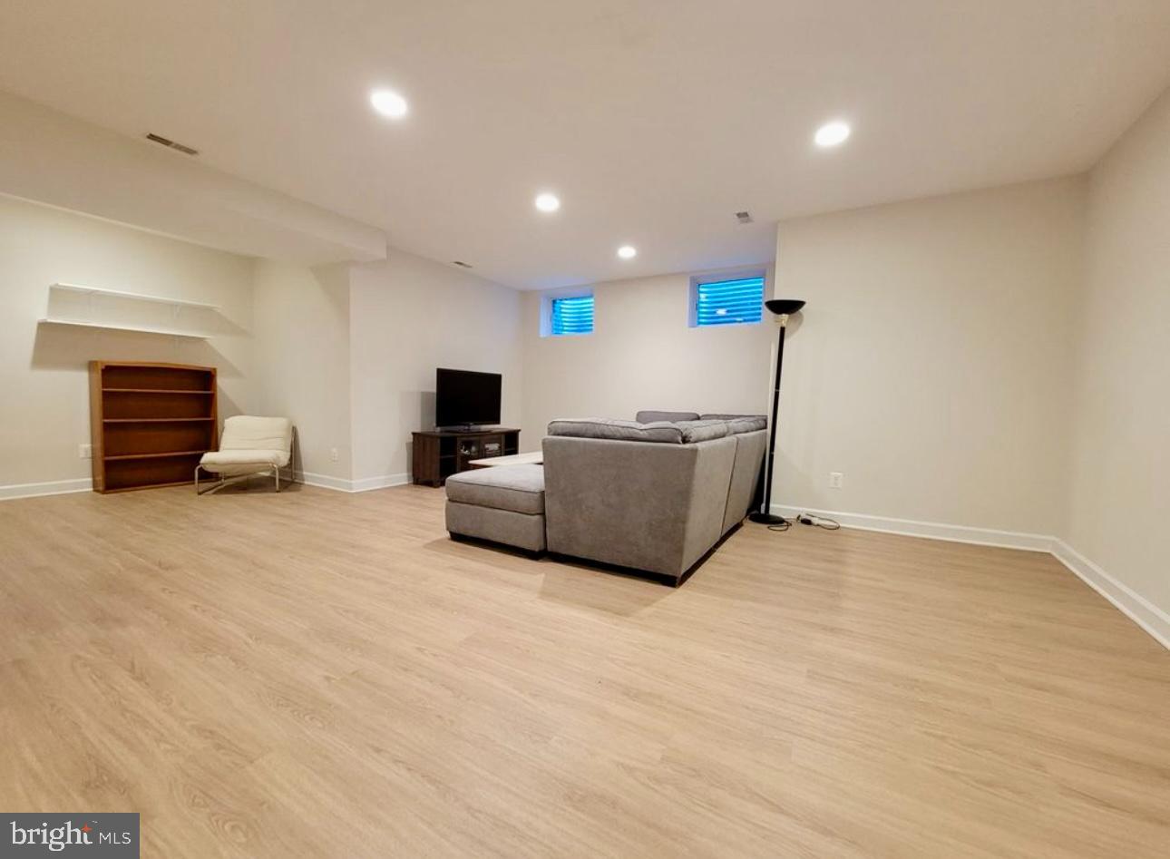 1418 44th Street Northwest, Unit B Washington, DC 20007 - Photo 18 of 20 a living room with furniture and a flat screen tv